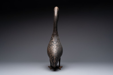 A large Qajar damascened steel bird-form sculpture, Persia, 19th C.
