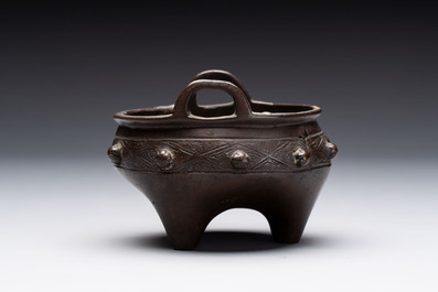 A Chinese archaistic bronze vase and a tripod censer, Yuan