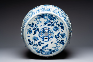 A Chinese blue and white 'birds among flowering branches' garden seat, 19th C.