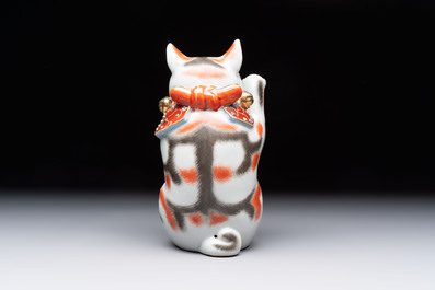 A Japanese Kutani figure of a Maneki-neko Beckoning Cat, 20th C.