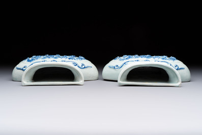 A pair of Chinese blue and white celadon-ground 'Buddhist lions' wall pocket vases, Yongzheng mark, 19/20th C.