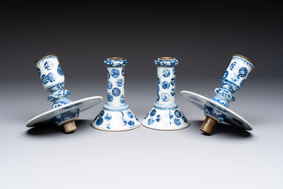 A pair of Chinese blue and white two-piece candle stick holders with brocade ball design for the Southeast Asian market, 19th C.