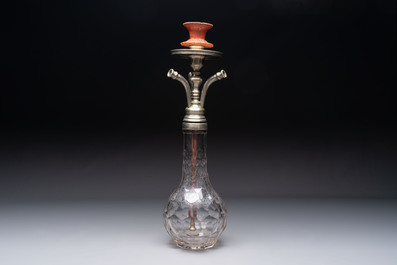 An Ottoman white-metal and Tophane pottery-mounted cut-crystal hookah, with three hose tubes and three amber-mounted mouthpieces, Turkey, 19th C.