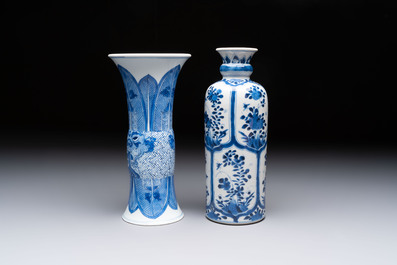 Three Chinese blue and white vases, one with wooden cover, Kangxi