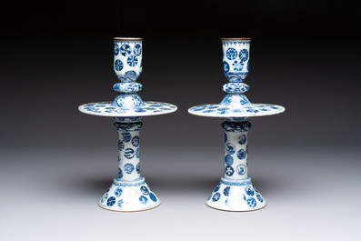 A pair of Chinese blue and white two-piece candle stick holders with brocade ball design for the Southeast Asian market, 19th C.