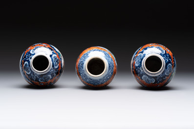A Chinese famille rose garniture of five 'mandarin subject' vases, Qianlong