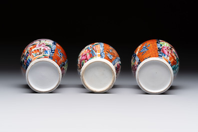 A Chinese famille rose garniture of five 'mandarin subject' vases, Qianlong