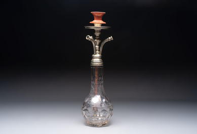 An Ottoman white-metal and Tophane pottery-mounted cut-crystal hookah, with three hose tubes and three amber-mounted mouthpieces, Turkey, 19th C.