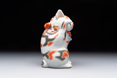 A Japanese Kutani figure of a Maneki-neko Beckoning Cat, 20th C.