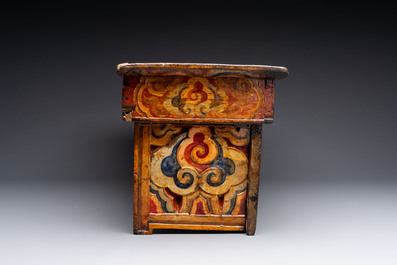 Two Tibetan polychromed wooden folding tables with dragon design, 19/20th C.