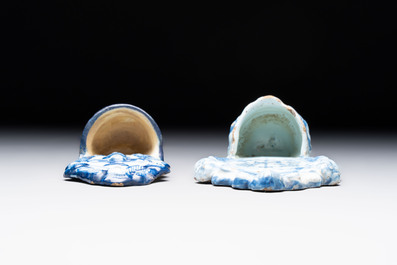 Two blue and white Dutch Delft holy water fonts, 17th C.