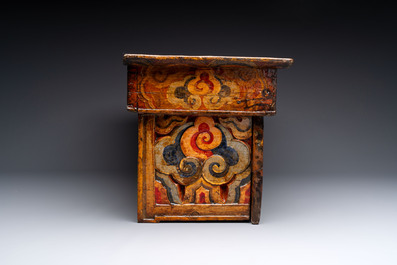 Two Tibetan polychromed wooden folding tables with dragon design, 19/20th C.