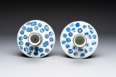 A pair of Chinese blue and white two-piece candle stick holders with brocade ball design for the Southeast Asian market, 19th C.