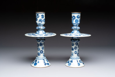 A pair of Chinese blue and white two-piece candle stick holders with brocade ball design for the Southeast Asian market, 19th C.