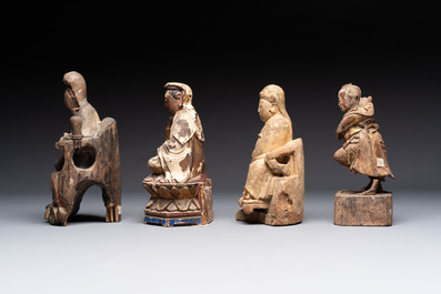 Eight various Chinese lacquered wooden figures, 19th C.