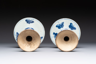 A pair of Chinese blue and white two-piece candle stick holders with brocade ball design for the Southeast Asian market, 19th C.