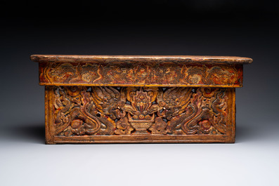 Two Tibetan polychromed wooden folding tables with dragon design, 19/20th C.