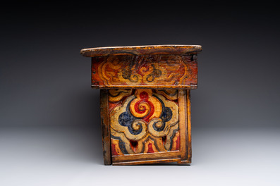 Two Tibetan polychromed wooden folding tables with dragon design, 19/20th C.