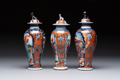 A Chinese famille rose garniture of five 'mandarin subject' vases, Qianlong