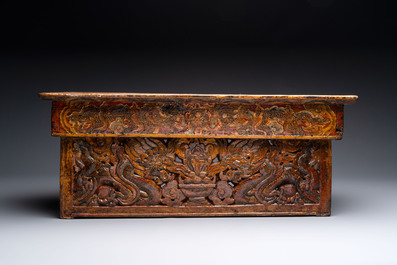 Two Tibetan polychromed wooden folding tables with dragon design, 19/20th C.