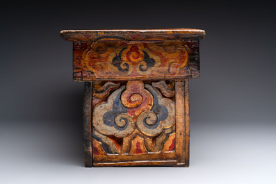 Two Tibetan polychromed wooden folding tables with dragon design, 19/20th C.