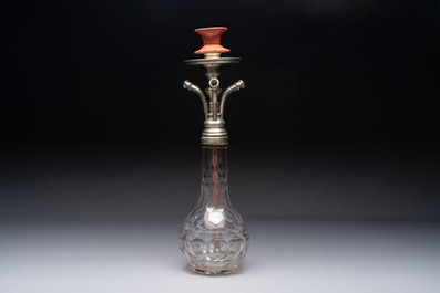 An Ottoman white-metal and Tophane pottery-mounted cut-crystal hookah, with three hose tubes and three amber-mounted mouthpieces, Turkey, 19th C.