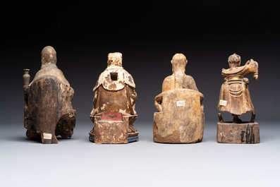 Eight various Chinese lacquered wooden figures, 19th C.