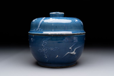 A rare Chinese Swatow white slip-decorated blue-ground bowl and cover, Ming