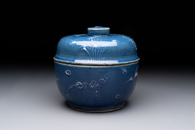 A rare Chinese Swatow white slip-decorated blue-ground bowl and cover, Ming