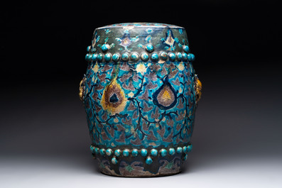 A Chinese Fahua barrel-shaped 'lotus scroll' stool with incised design, Ming