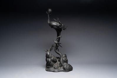 A large Japanese bronze dragon holding a pearl, Meiji, 19th C.