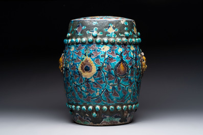 A Chinese Fahua barrel-shaped 'lotus scroll' stool with incised design, Ming