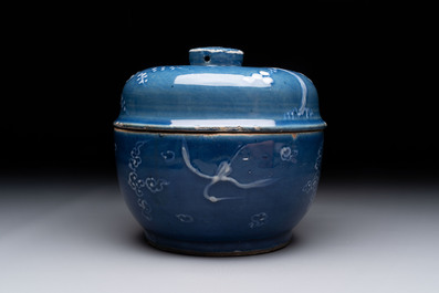 A rare Chinese Swatow white slip-decorated blue-ground bowl and cover, Ming