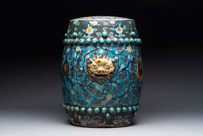A Chinese Fahua barrel-shaped 'lotus scroll' stool with incised design, Ming