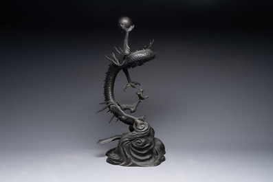 A large Japanese bronze dragon holding a pearl, Meiji, 19th C.