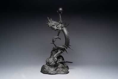 A large Japanese bronze dragon holding a pearl, Meiji, 19th C.