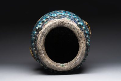 A Chinese Fahua barrel-shaped 'lotus scroll' stool with incised design, Ming