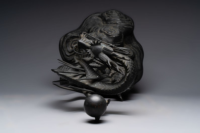 A large Japanese bronze dragon holding a pearl, Meiji, 19th C.