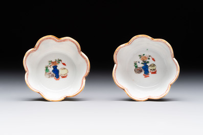 A pair of Chinese famille verte cups and saucers with antiquities, Kangxi