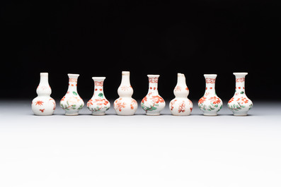 Eight Chinese wucai and gilt-iron-red miniature vases with floral design, Kangxi
