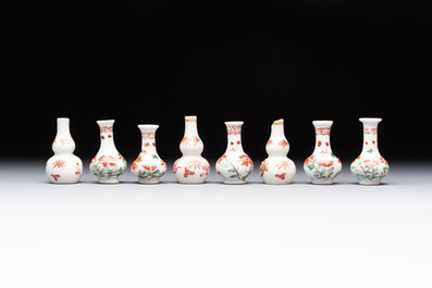 Eight Chinese wucai and gilt-iron-red miniature vases with floral design, Kangxi