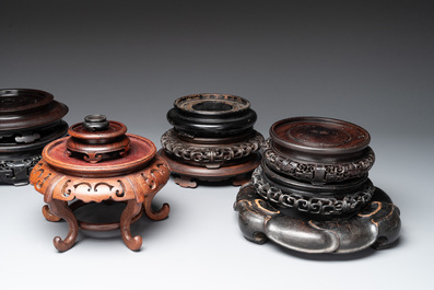 A collection of 11 Chinese wooden stands, 19/20th C.