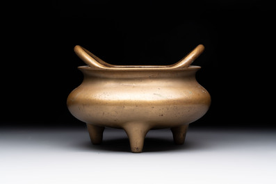 A Chinese bronze tripod censer, Xuande mark, 18th C.