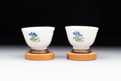 A Chinese blue and white 'prunus on cracked ice' jar, a tea caddy, a covered teapot, and four famille rose cups, 19th C.