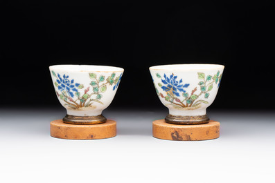 A Chinese blue and white 'prunus on cracked ice' jar, a tea caddy, a covered teapot, and four famille rose cups, 19th C.