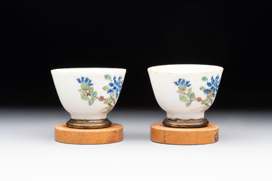 A Chinese blue and white 'prunus on cracked ice' jar, a tea caddy, a covered teapot, and four famille rose cups, 19th C.