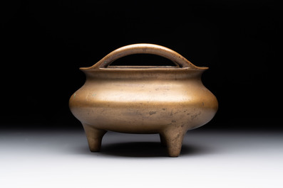 A Chinese bronze tripod censer, Xuande mark, 18th C.