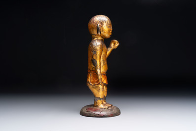 A rare and large Chinese gilt-lacquered bronze Buddha, Ming