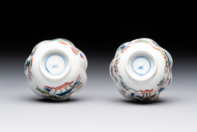A pair of Chinese famille verte cups and saucers with antiquities, Kangxi