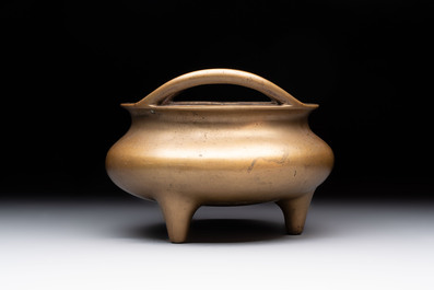 A Chinese bronze tripod censer, Xuande mark, 18th C.